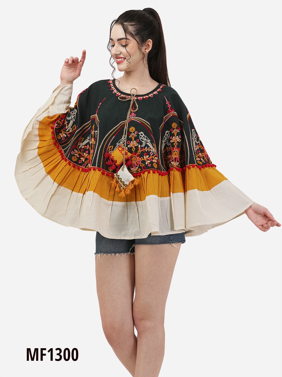 CIRCULAR PONCHO Minute woollen and jute embroidery both front and back decorated by Dazzling laces with acrylic embroidery.
