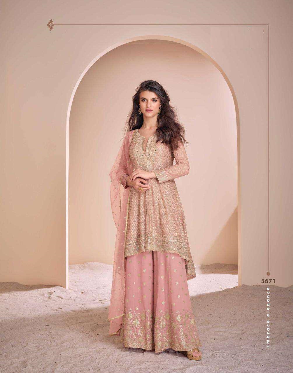 REAL GEROGETTE HEAVY LOOK EMBROIDERED TOP WITH HAND SEROSKI SUIT